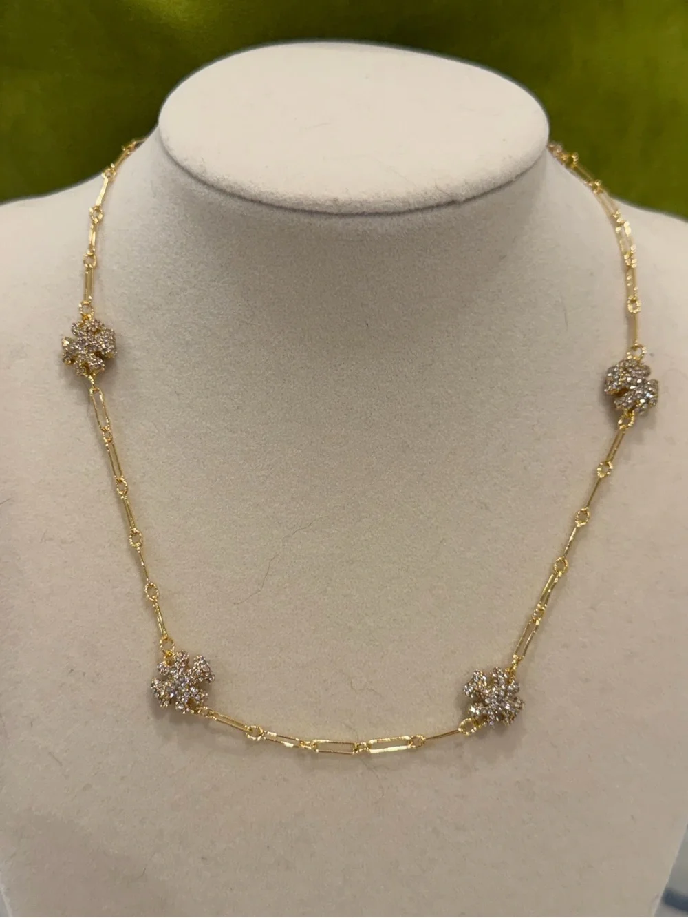 Tory Burch pave logo shape link necklace.